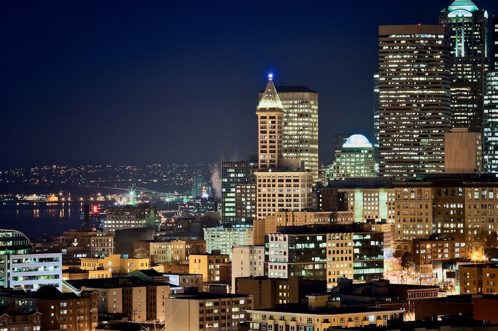 Downtown Seattle, Washington buildings at night with Elliott Bay visible