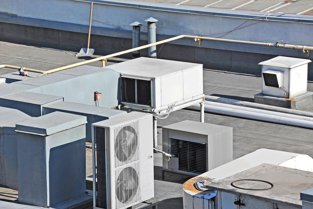 Crowded Commercial Flat Roof Commercial flat roof crowded with HVAC units and no signs of ponding water