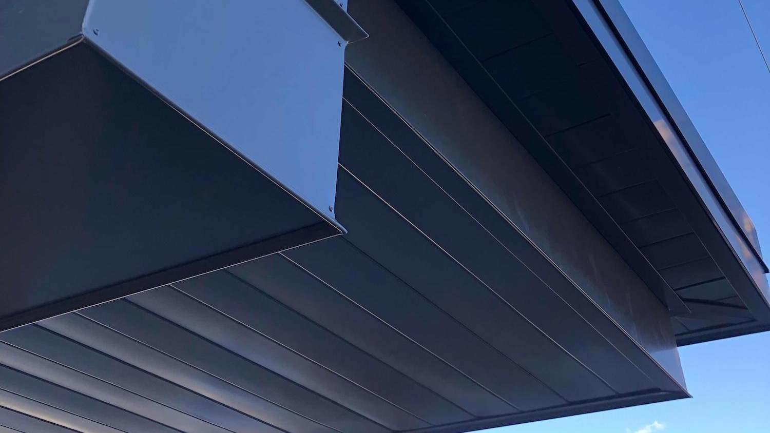 Soffit and Fascia Against a Blue Sky Background