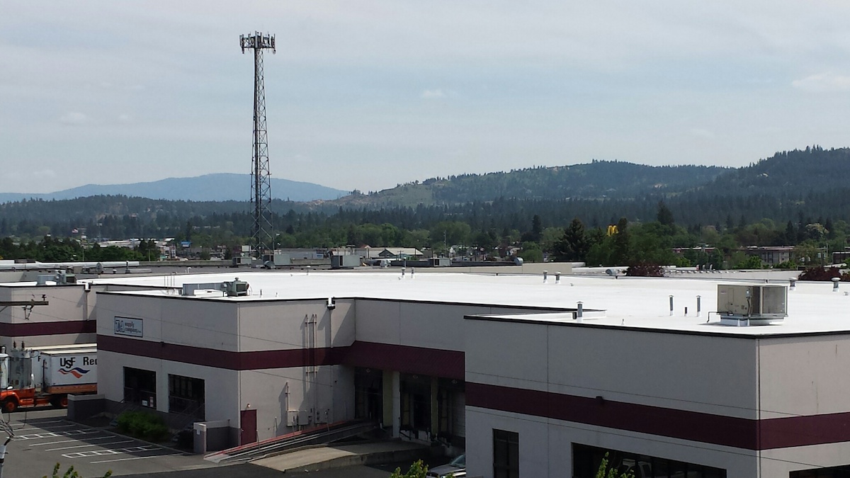 44,000 Square Foot Industrial Warehouse Flat Roof Recovered In TPO Membrane Over EPDM