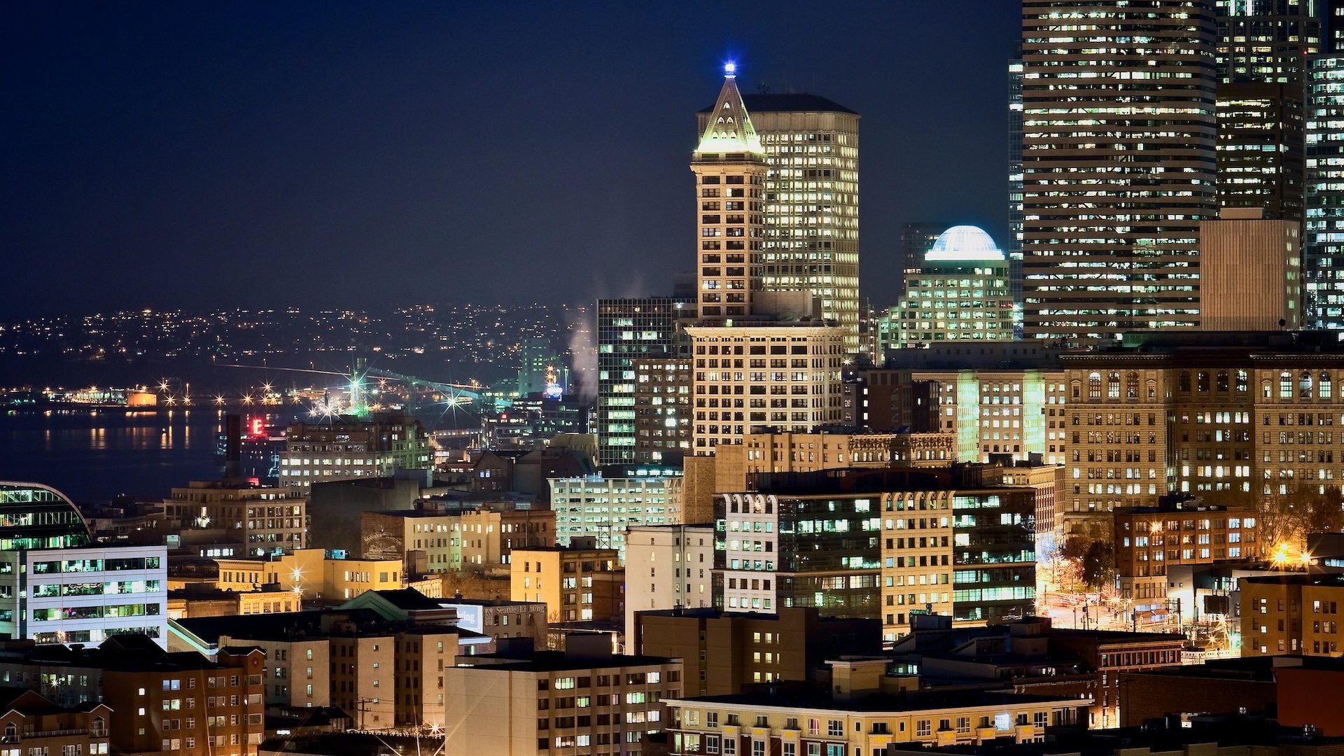 Downtown Seattle, Washington Downtown Seattle, Washington buildings at night with Elliott Bay visible