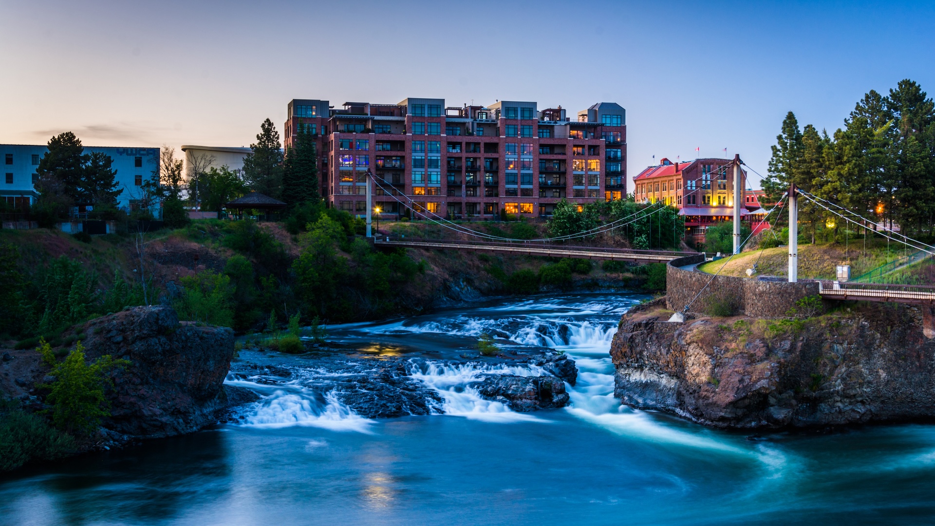 Spokane Falls At Twilight Twilight view of Spokane Falls, apartment building and Flour Mill in Spokane, Washington